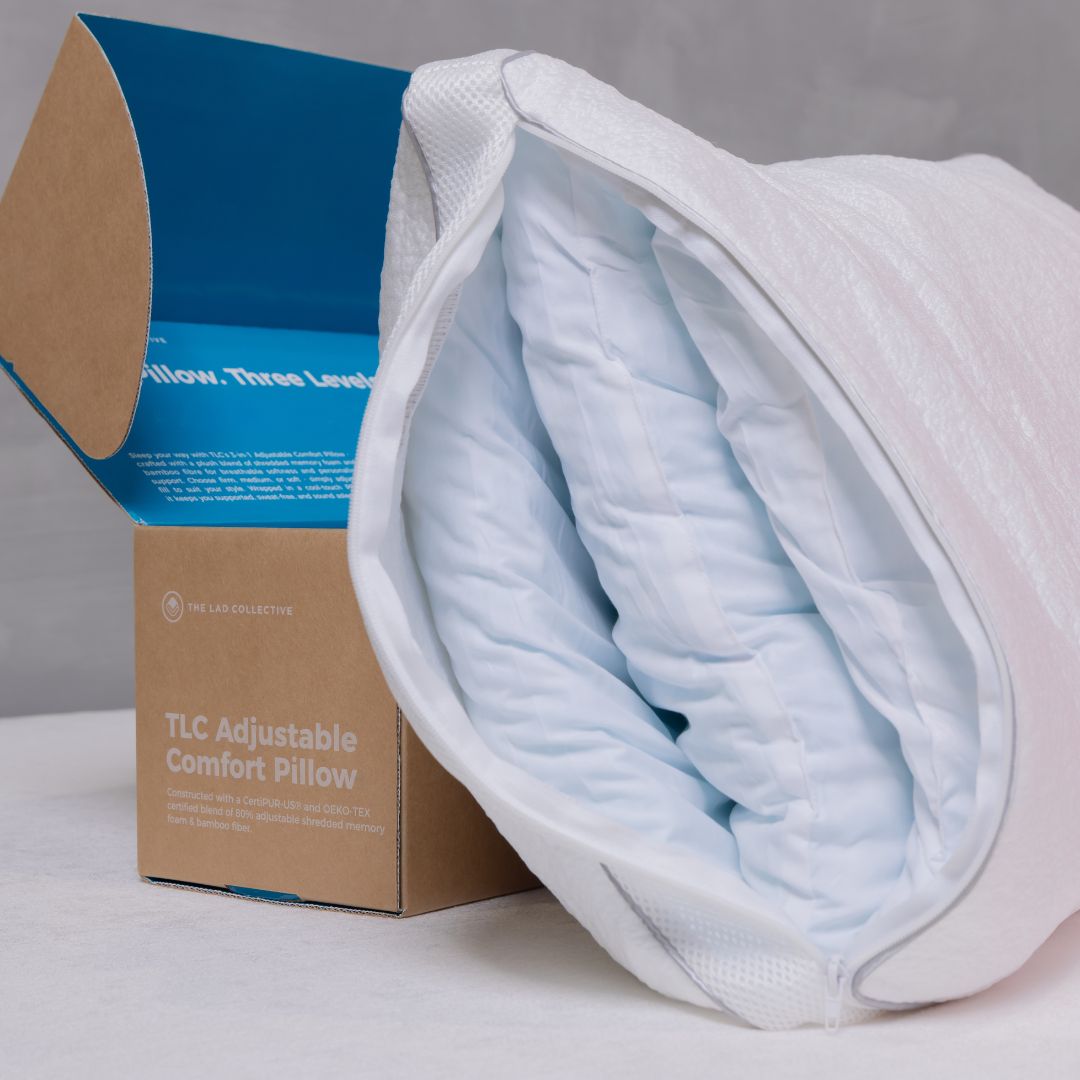 TLC Adjustable Comfort Pillow with packaging on a gray background
