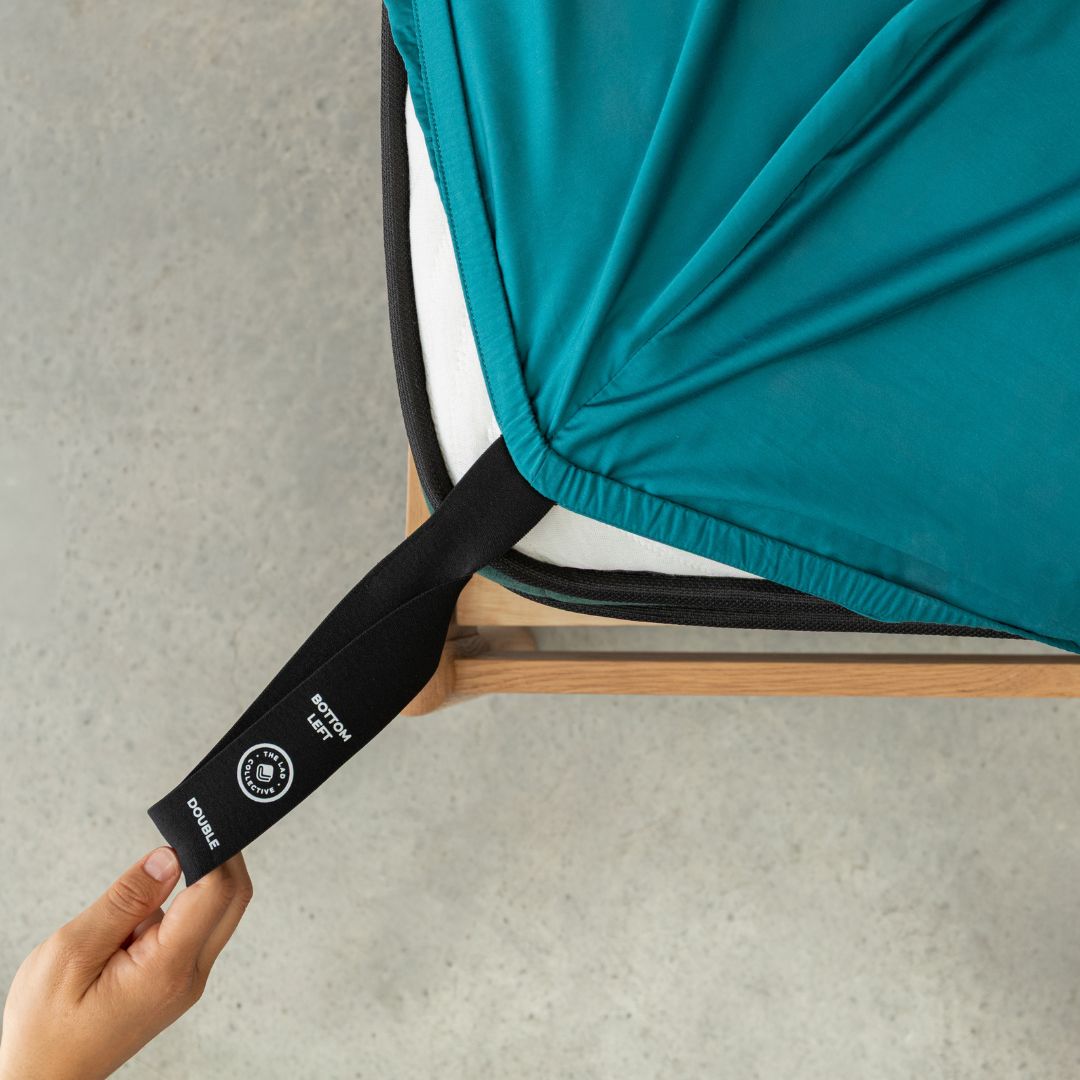 Teal bed sheets with corner straps curtain background 