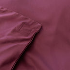 Close-up of a maroon fabric with a magnetic pocket detail