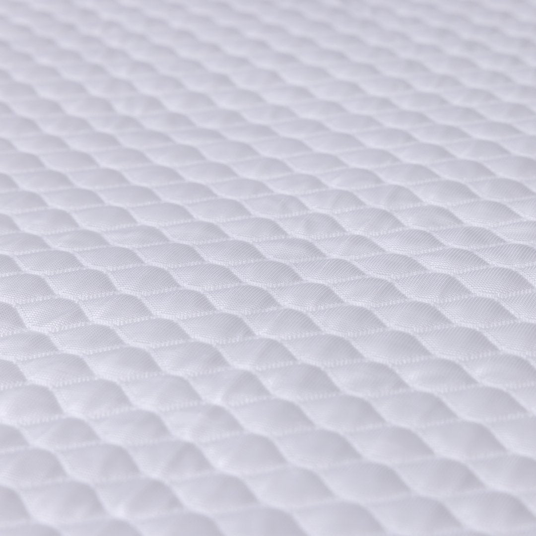 Close-up of white textured fabric on Waterproof Mattress Protector.