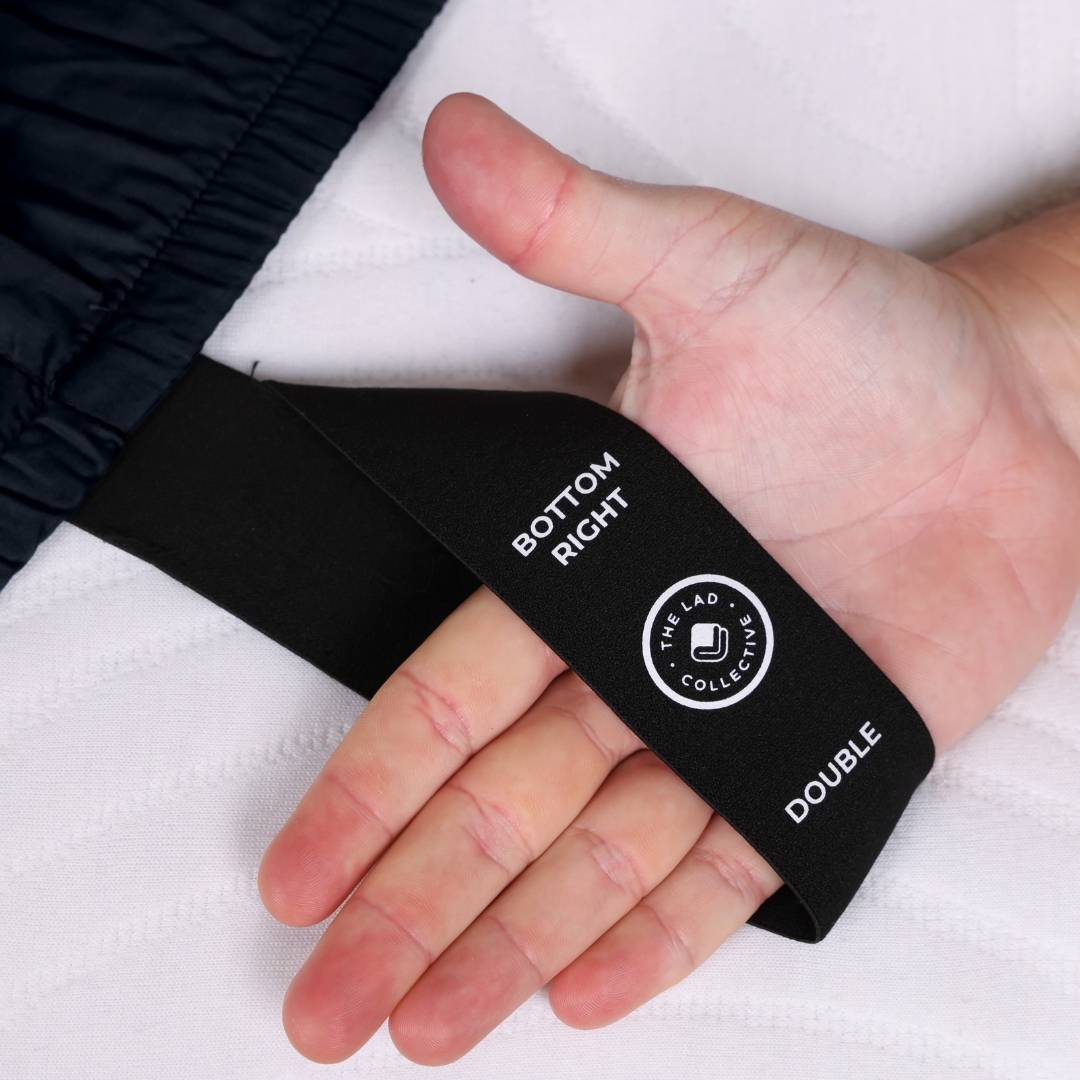 Black labelled corner loop strap with text and logo on a white background.