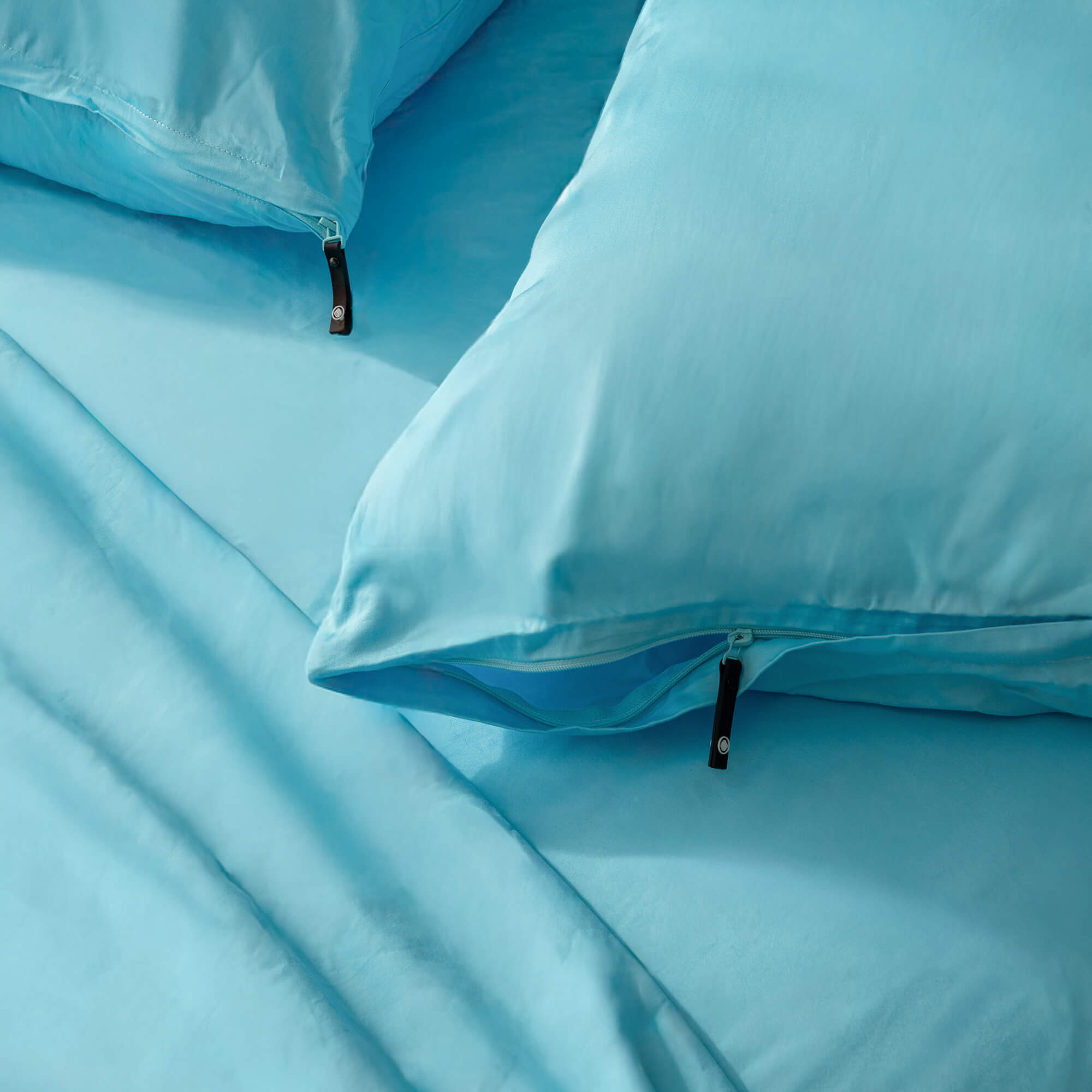 Close-up of a blue pillowcase with zippers