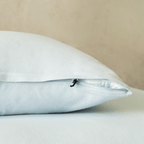 Close-up of a light blue pillowcase featuring a concealed zipper closure, highlighting the secure fastening detail and soft, smooth fabric finish.