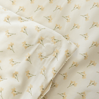 Close-up corner view of cream floral print fabric showing square-stitched corner reinforcement detail
