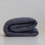 Charcoal coloured cooling blanket folded.