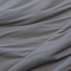 Charcoal coloured cooling blanket close up of fabric texture.