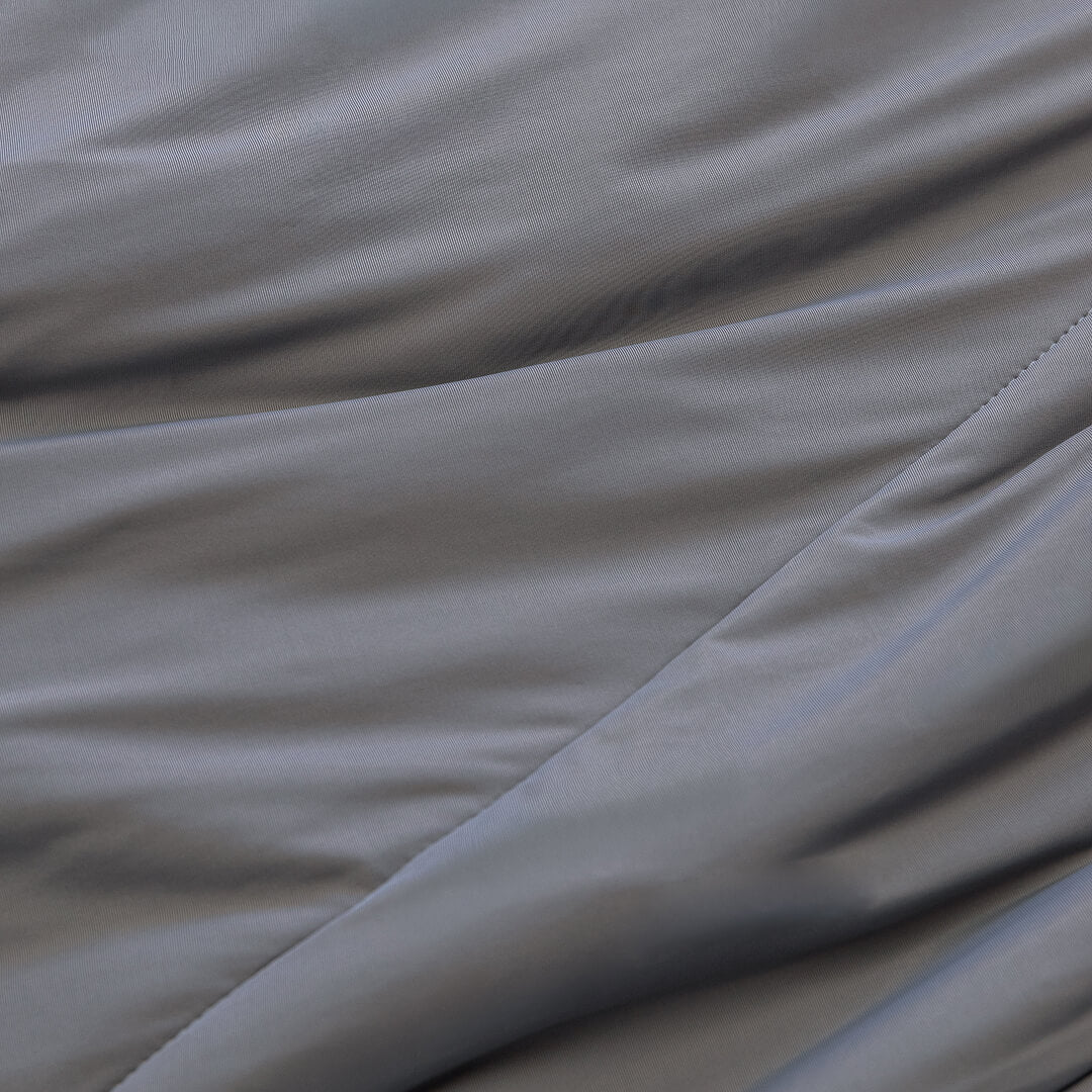 Charcoal coloured cooling blanket close up of fabric texture.