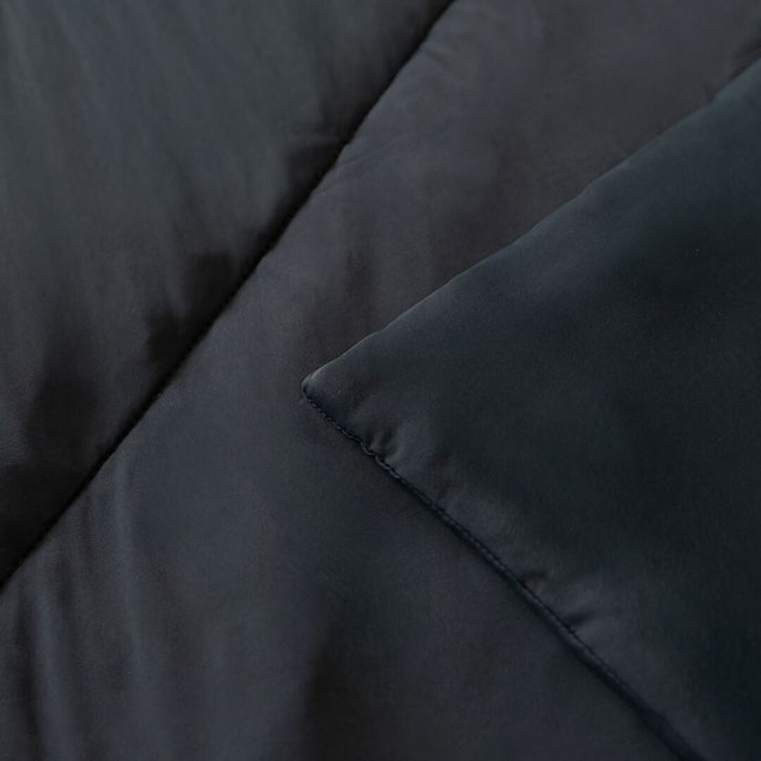 Close up of corners and stitching of black cooling blanket.