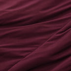 Close-up of burgundy fabric with folds