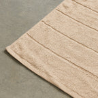 Beige bath towel corner detail