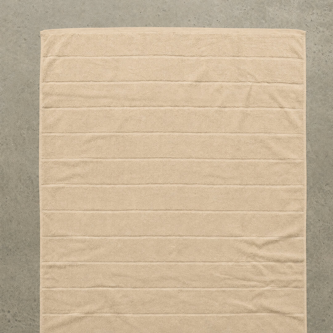 Beige bath towel flat lay