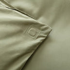 Sage green quilt cover magnetic corner close-up.