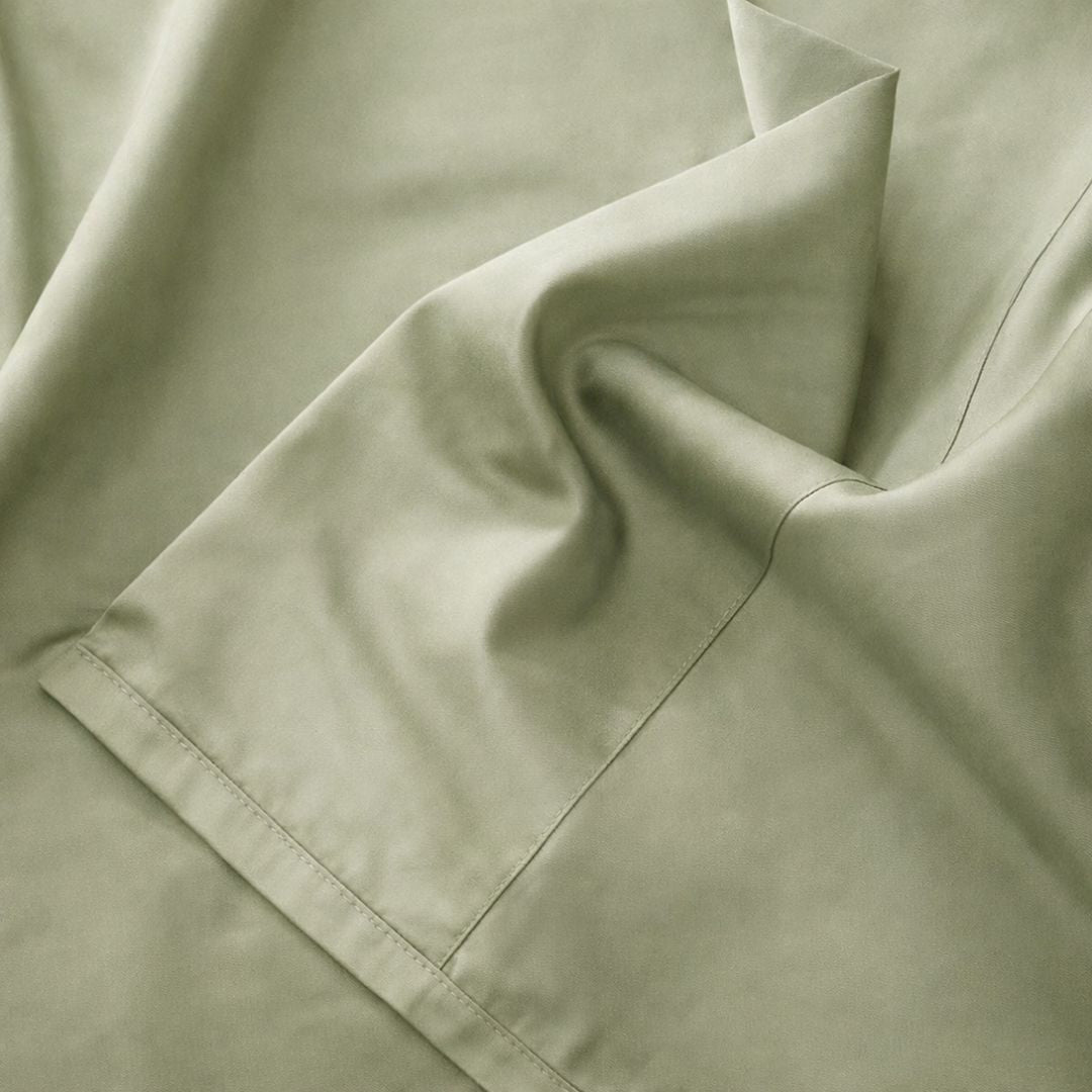 Close-up of beige fabric with a folded edge.