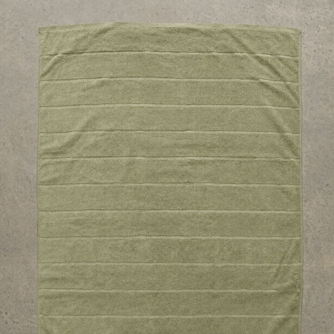 Sage bath towel flat lay 