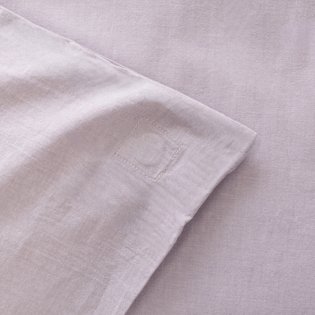 Close-up of the Daylesford quilt cover showing the internal corner tie for securing the quilt insert.