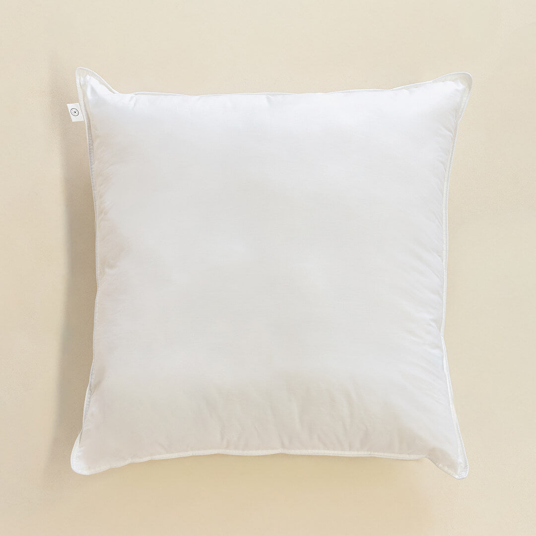 White European pillow on a beige background.