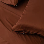 Chocolate brown pillowcases with zips.