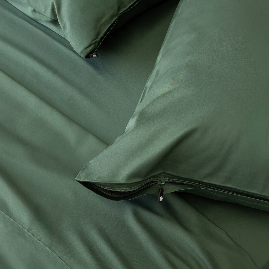 Green pillowcases with zips.