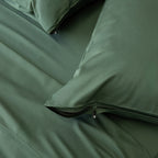 Green pillowcases with zips.