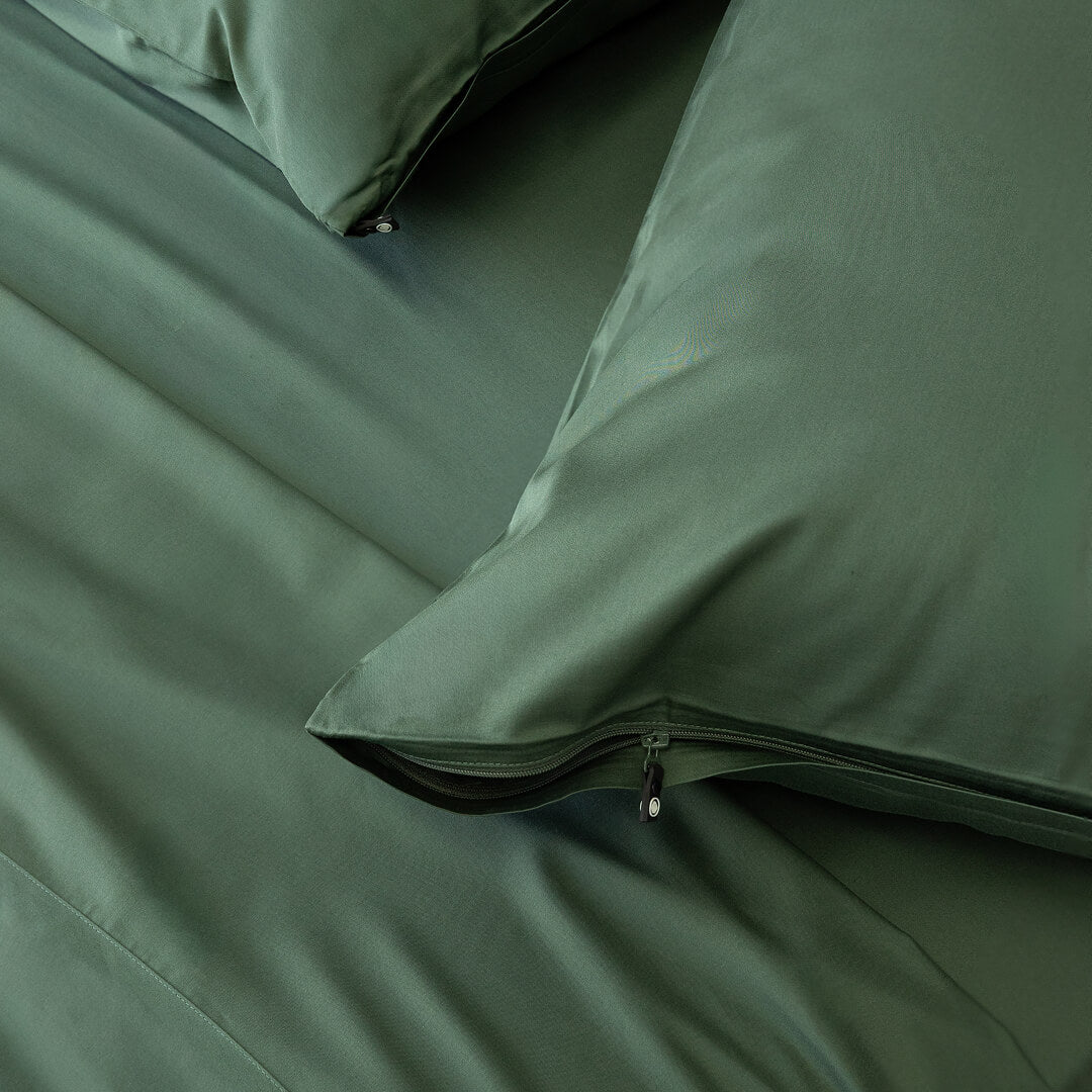 Green pillowcases with zips.