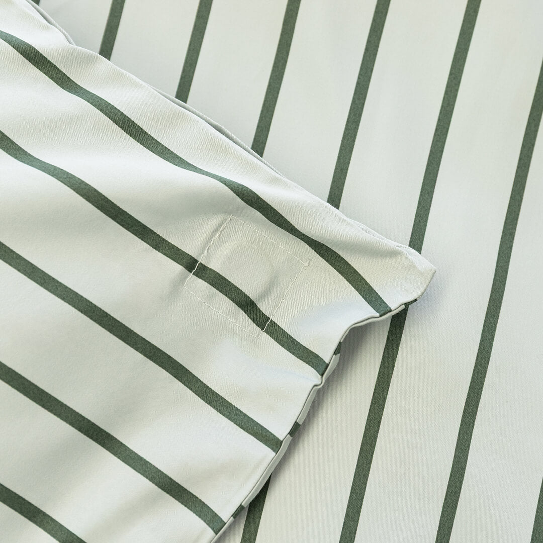 Close up of magnetic corner in stripe quilt cover.