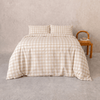 Beige gingham quilt cover set styled on a bed with matching pillowcases, featuring a timeless checkered pattern, soft drape, and warm neutral tones for a cozy bedroom aesthetic.