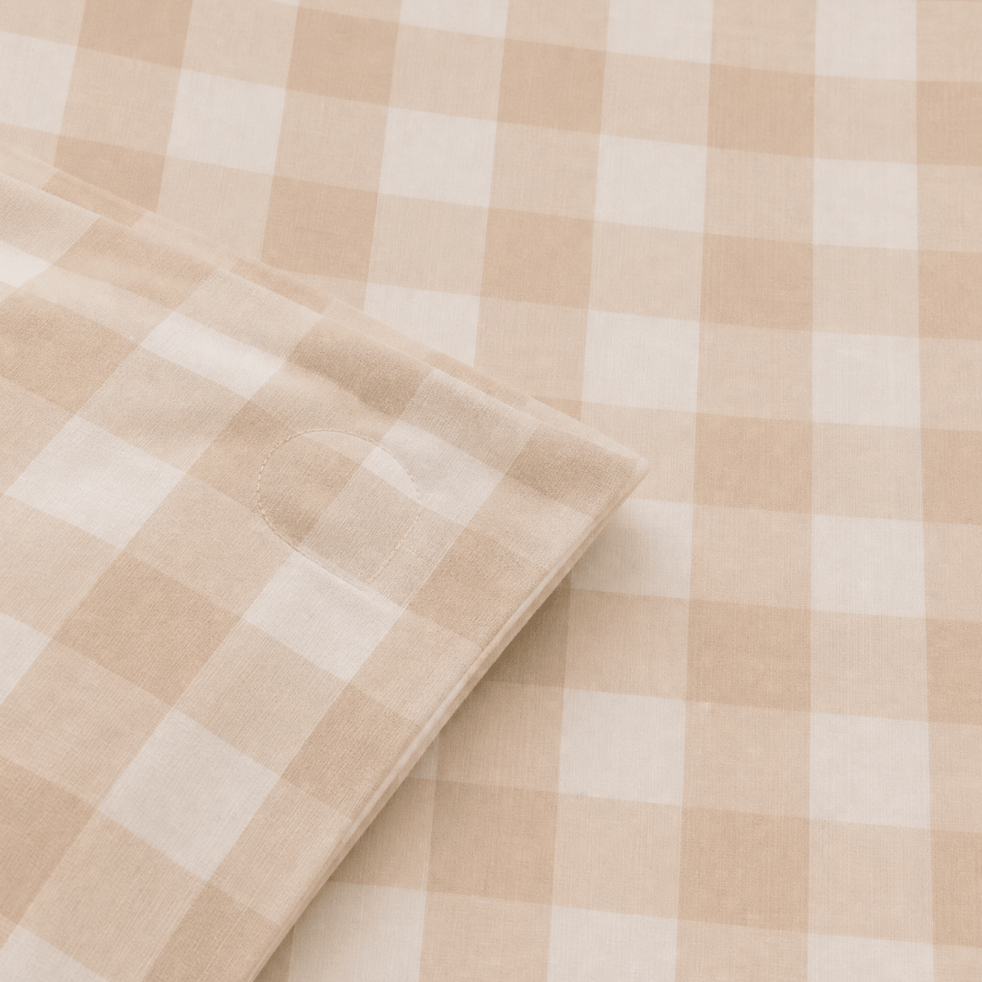 Detailed view of the quilt cover corner ties, showcasing the internal fabric loops designed to secure a quilt insert and prevent shifting.