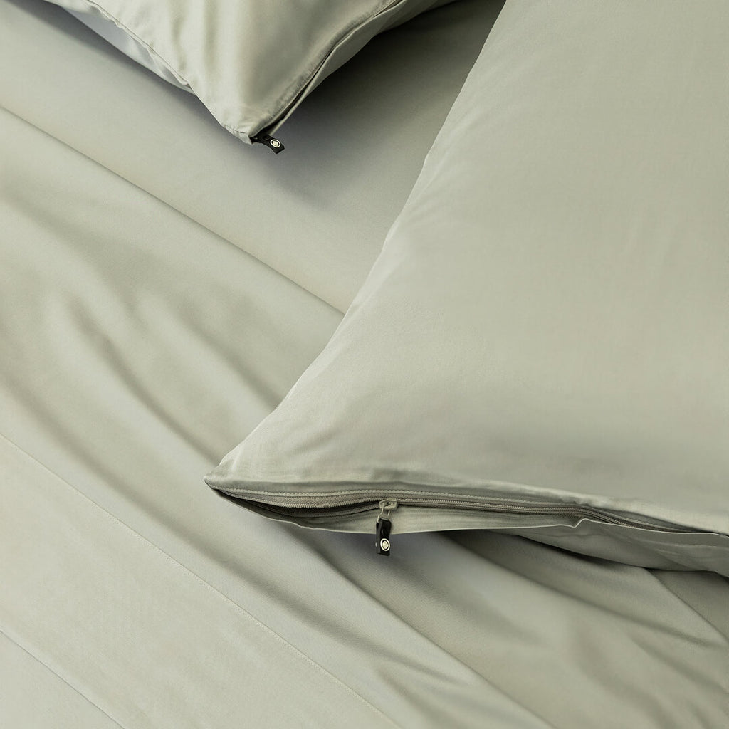 Light grey pillowcases with zips.