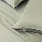 Light grey pillowcases with zips.