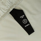 Light grey fitted sheet with labelled corner strap.