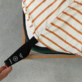 Striped fitted sheet with a black strap labeled 'Double' on a grey background.