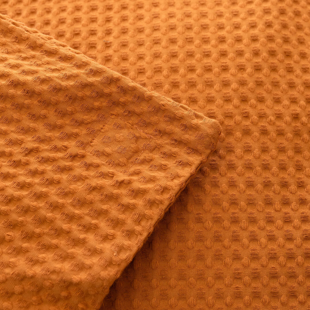 Close-up of orange textured fabric