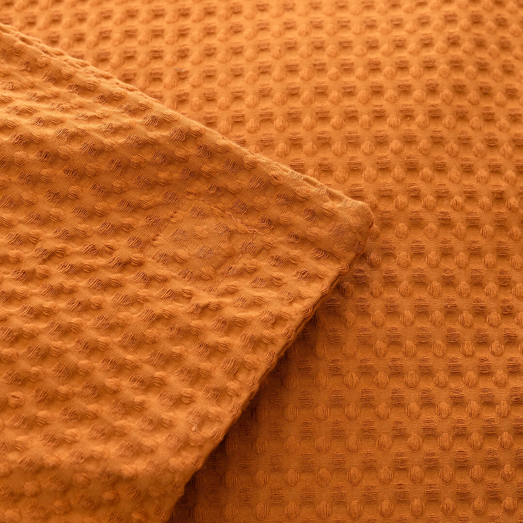 Close-up of orange textured fabric
