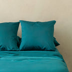 Teal bedding, featuring European pillowcases.