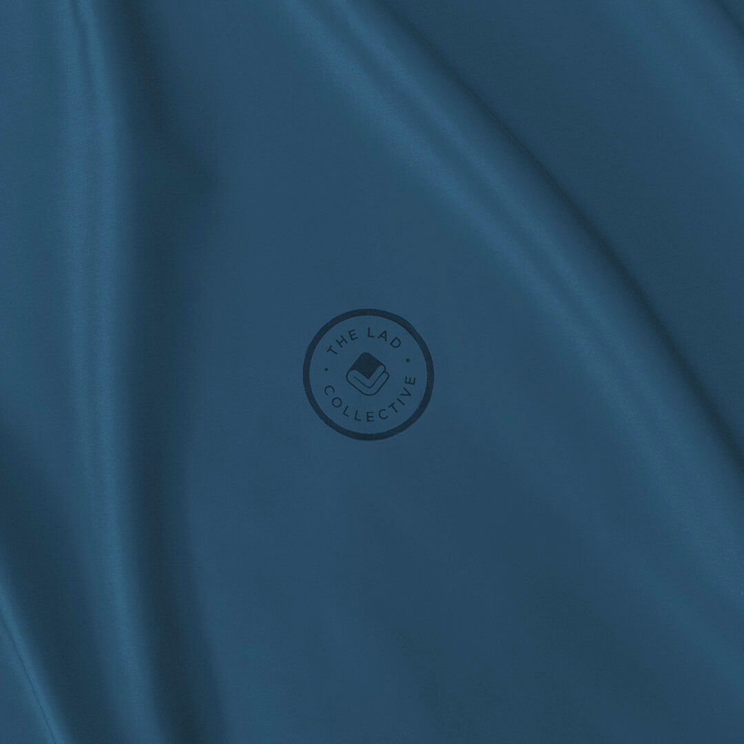 Blue fabric with a circular logo in the centre.