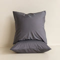 Two grey European pillowcases against a neutral background. 