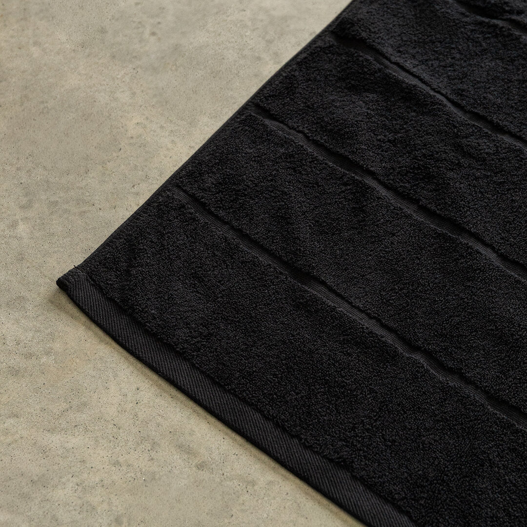 Black bath towel corner.