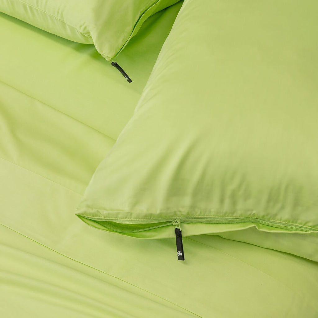 Green pillows on a matching green background.