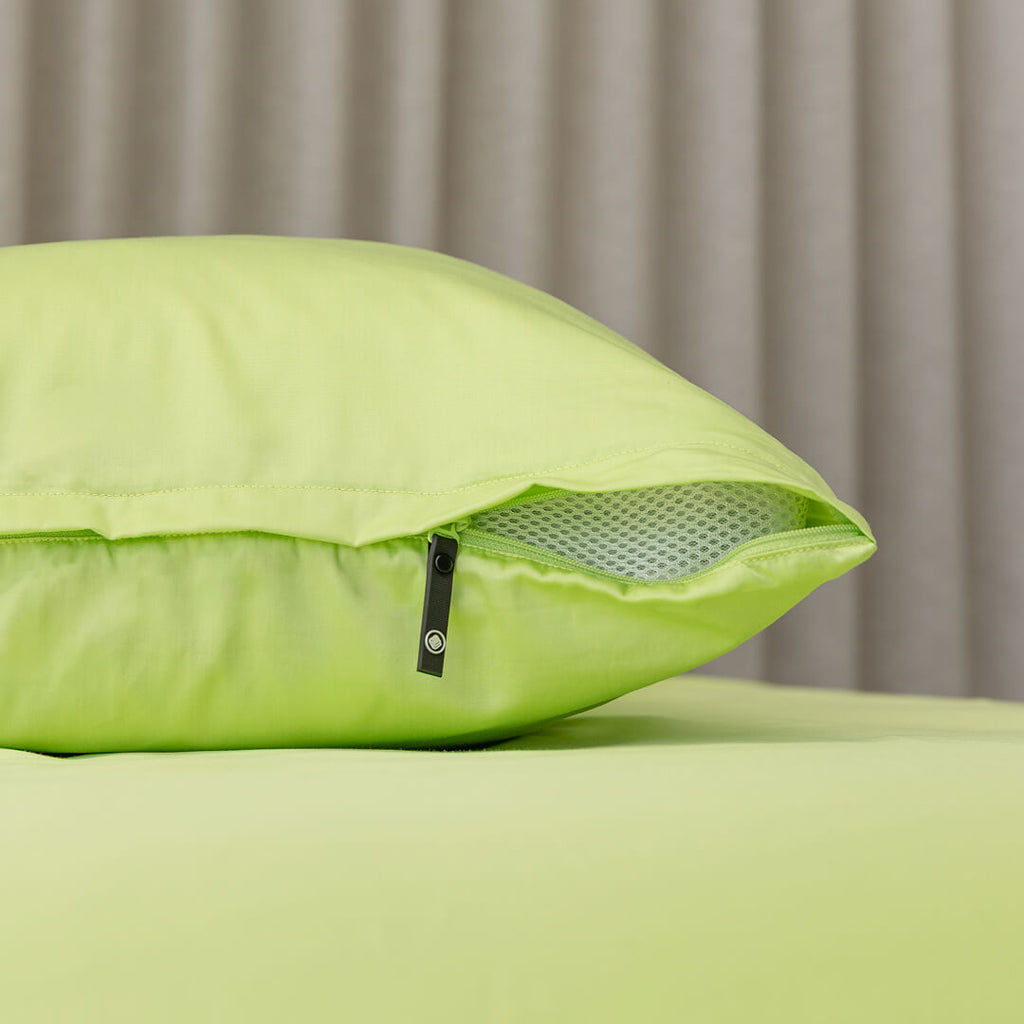 Lime green pillowcase, showcasing the invisible zipper detail. 