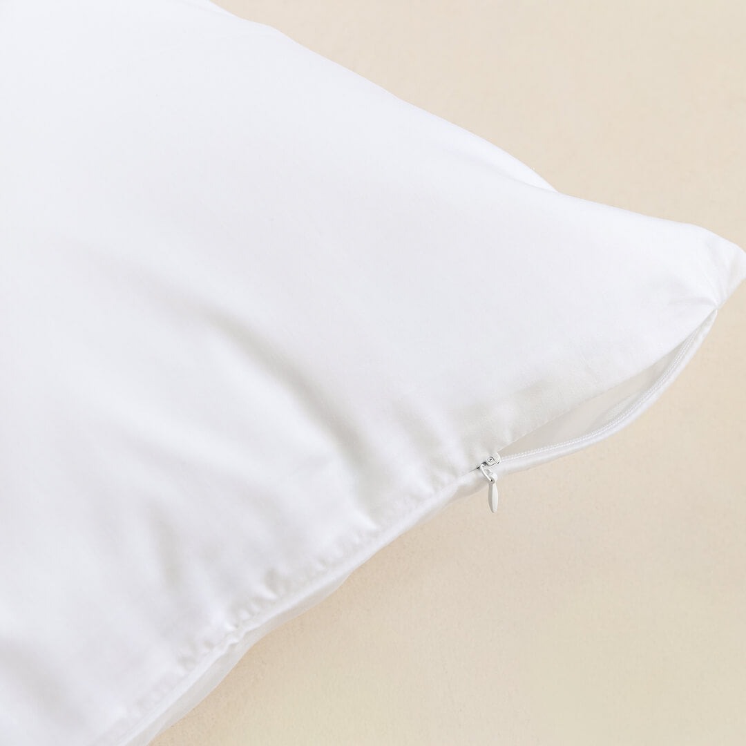 White pillowcase zipper closeup.