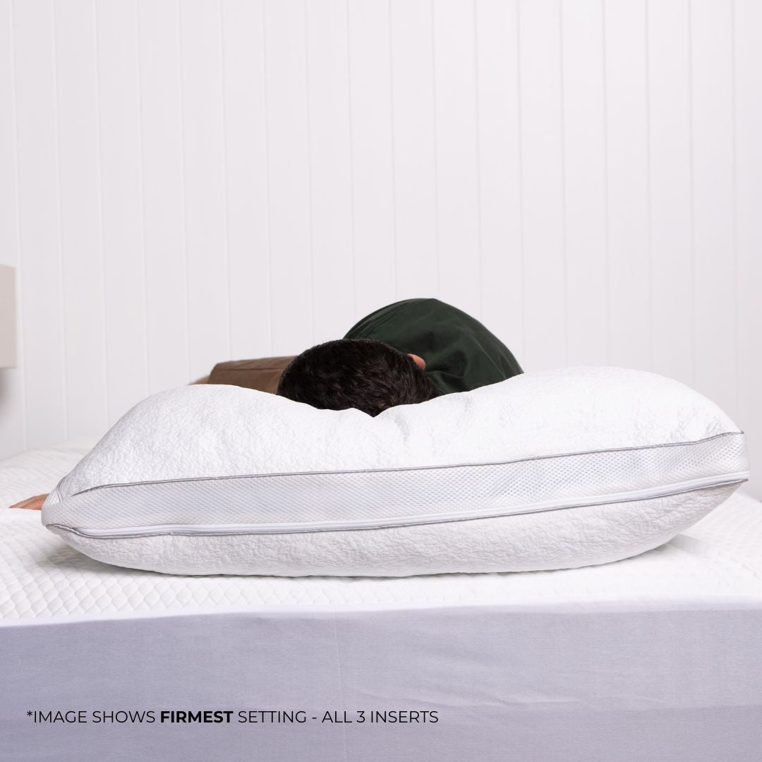 Person laying on bed with pillow