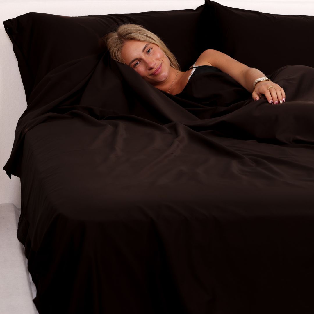 Girl in brown bed sheets