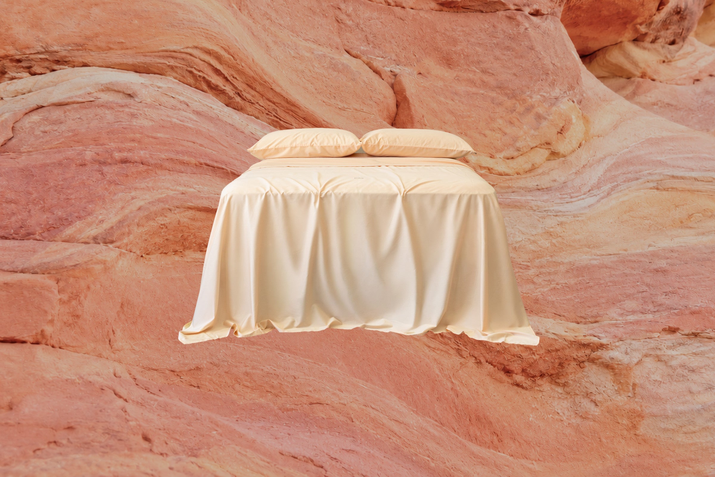 Bedding styled against the Rainbow Valley landscape